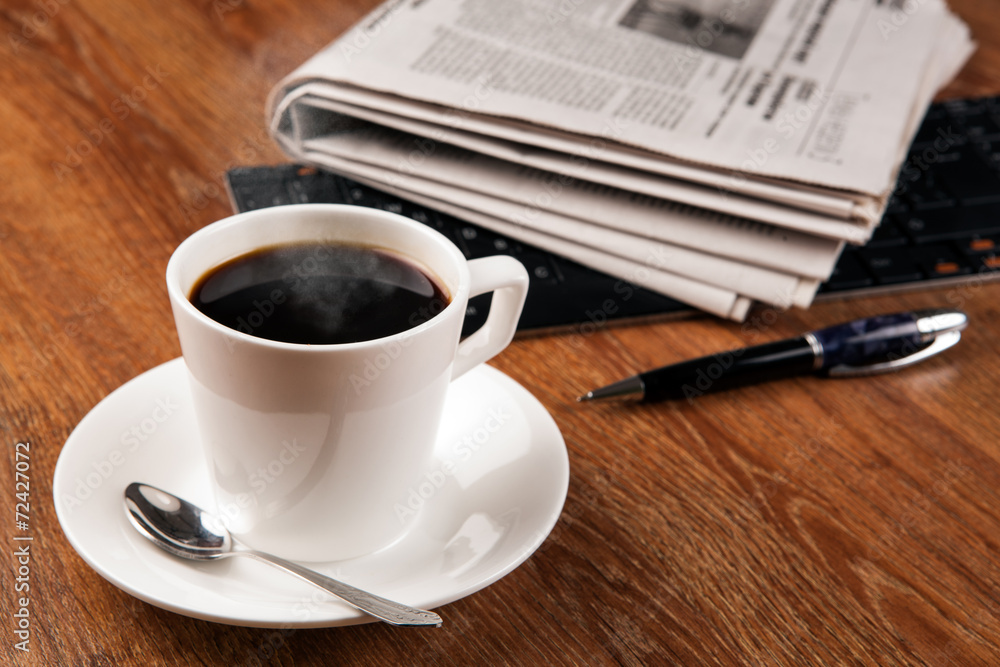 cup of coffee and the newspaper cup of coffee and the newspaper
