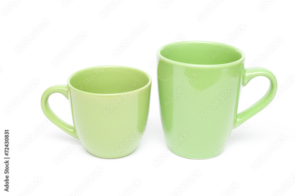 Two green mugs empty blank, isolated on white background Two green mugs empty blank, isolated on white background