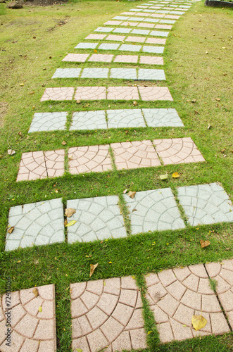 colorful cement walkway on green grass
