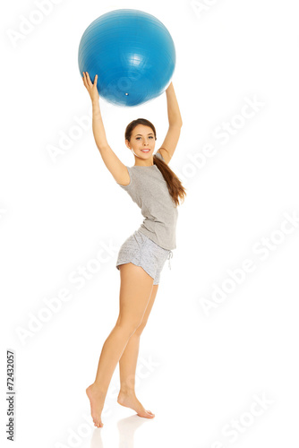 Woman holding fitness ball