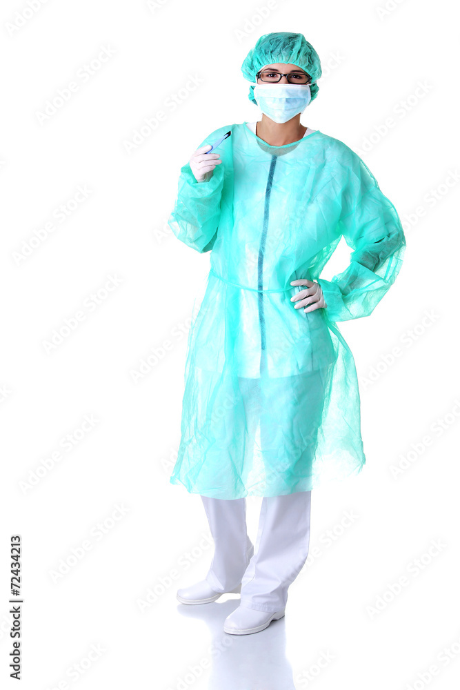 Female doctor holding a scalpel Female doctor holding a scalpel