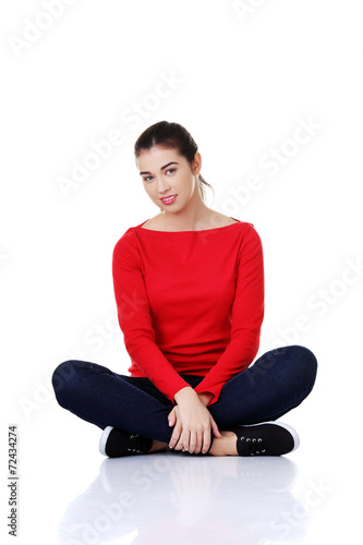 Young woman sitting cross legged