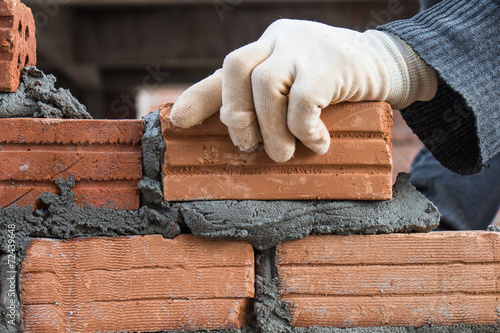 Building brick block wall on construction plant