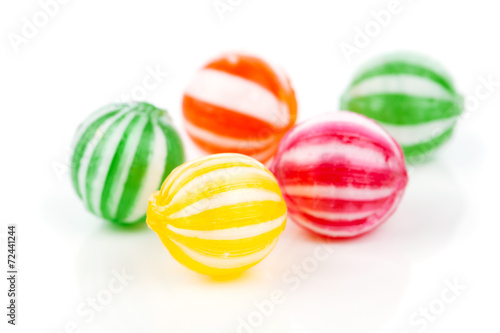 colored candies isolated on white.