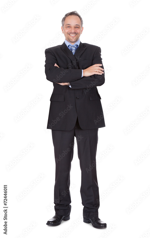 Portrait Of Happy Businessman Standing Arms Crossed Portrait Of Happy Businessman Standing Arms Crossed