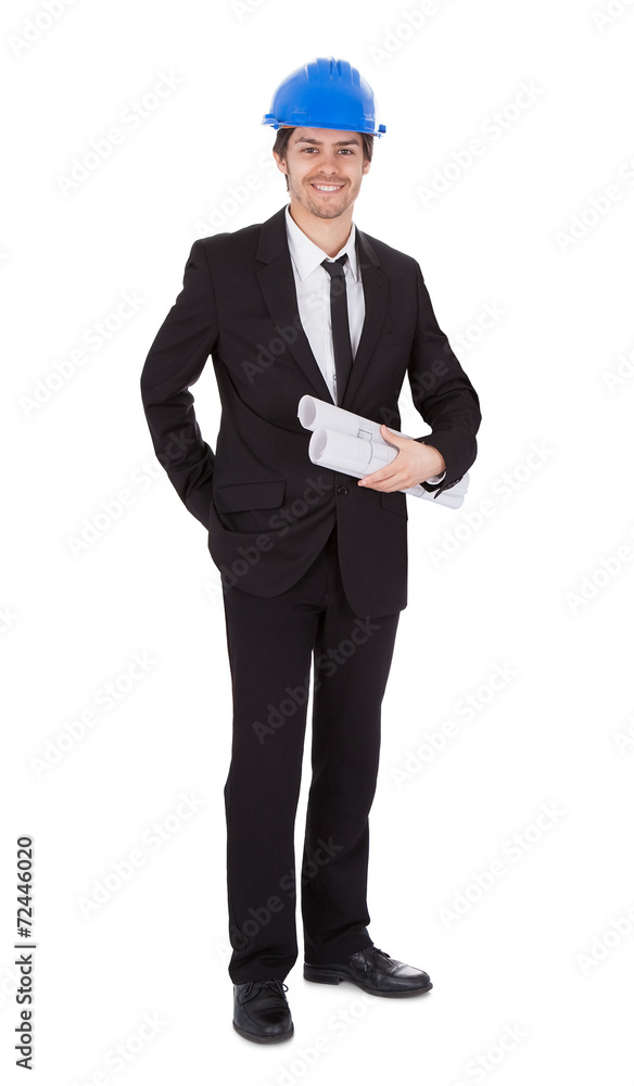 Portrait Of Confident Architect Holding Blueprints Portrait Of Confident Architect Holding Blueprints
