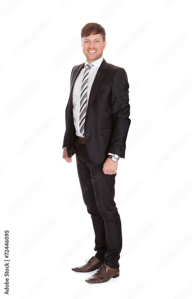 Smiling Businessman Standing Over White Background Smiling Businessman Standing Over White Background