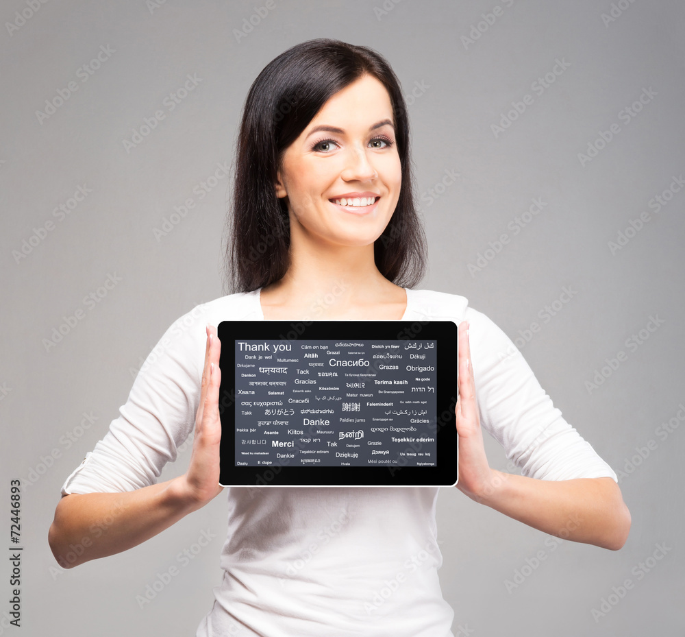 Young and beautiful teenager girl holding a tablet computer Young and beautiful teenager girl holding a tablet computer