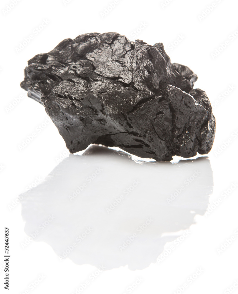 Lump of charcoal over white background Lump of charcoal over white background