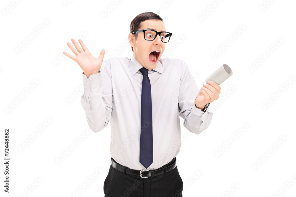 Man panicking over an empty toilet paper roll Man panicking over an empty toilet paper roll