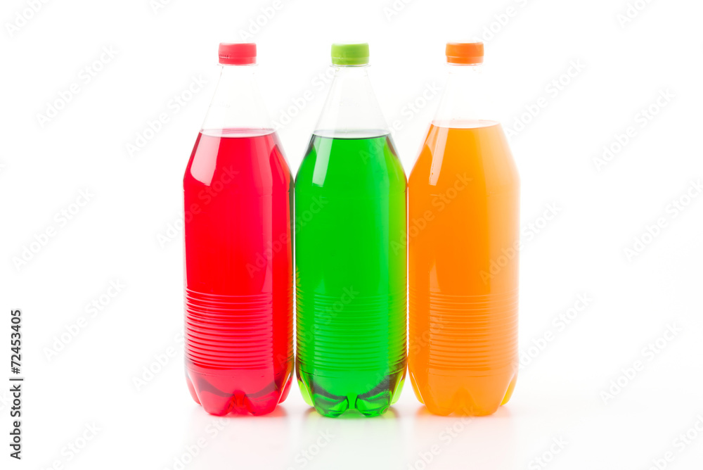Bottles with soft drinks, isolated on a white background Bottles with soft drinks, isolated on a white background