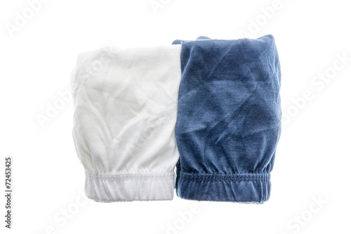 Pile of male underwear on white background.