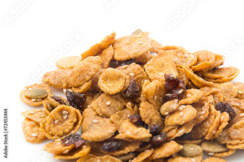 cornflakes and caramel isolated on white background