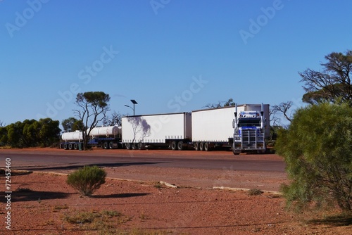 A long truck train on Stuart highway in the desert