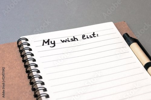 Hand drawing wish list on notebook
