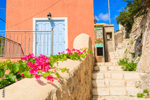 Flowers and blue door of a house in Assos, Kefalonia island