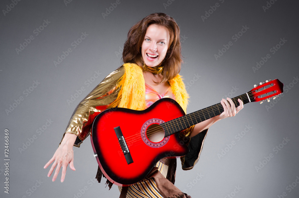 Guitar player with red instrument