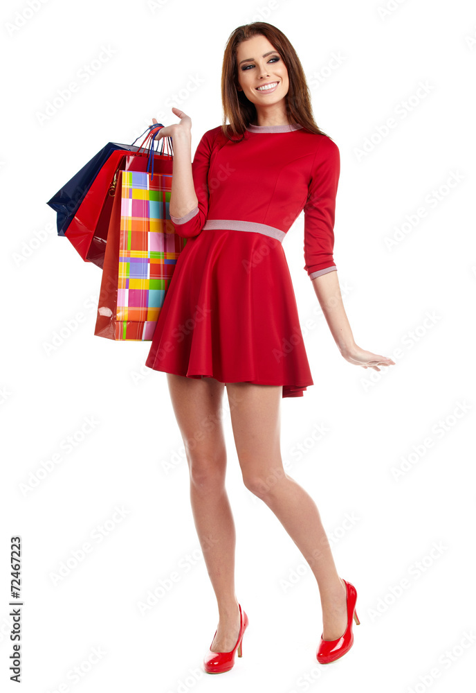 Young happy smiling woman with shopping bags, isolated over whit