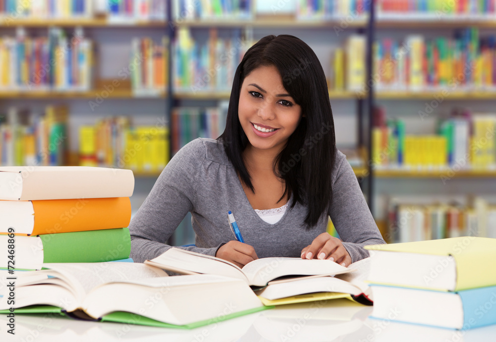 Happy College Student Studying In Library Happy College Student Studying In Library