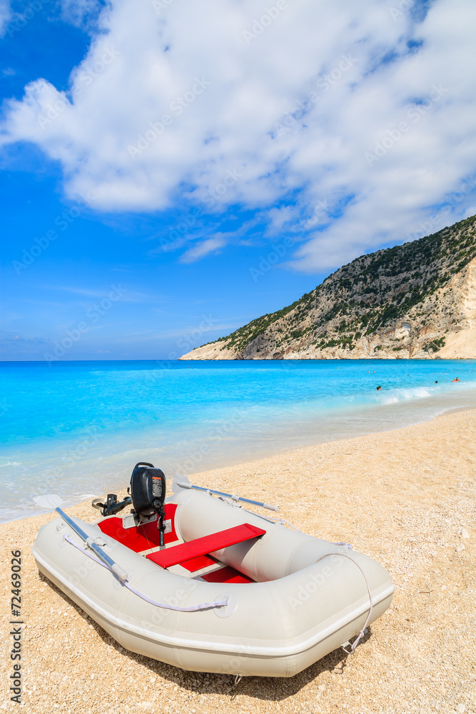 Pontoon boat on idyllic Myrtos beach, Kefalonia island, Greece