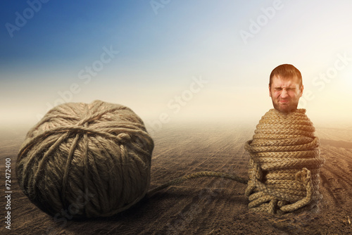 Man in captivity of threads