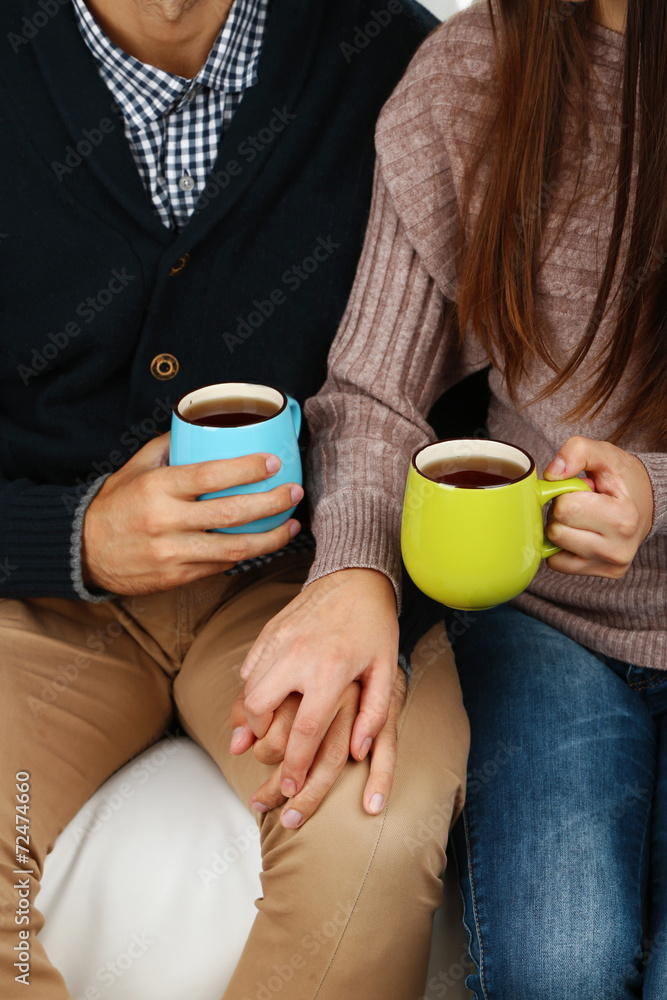 Loving couple with hot drinks Loving couple with hot drinks
