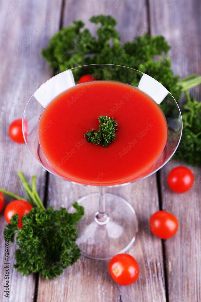 Tomato juice in goblet, parsley and fresh tomatoes Tomato juice in goblet, parsley and fresh tomatoes