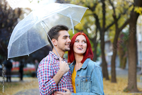 Loving couple under an umbr...