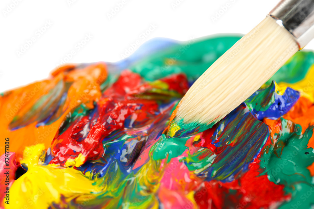 Obraz premium Paint brush with colorful paints, close up