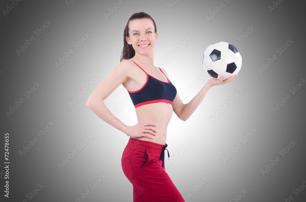 Young woman with football on white Young woman with football on white