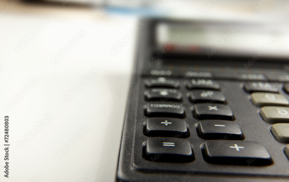 Calculator, pen, folder with documents, laptop Calculator, pen, folder with documents, laptop