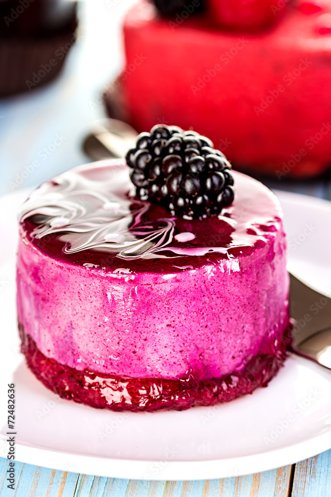 Souffle, cake berry, jelly on the wooden blue background Souffle, cake berry, jelly on the wooden blue background