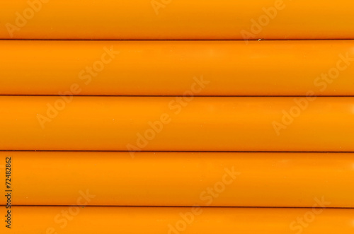 Orange plastic tubing pattern texture background