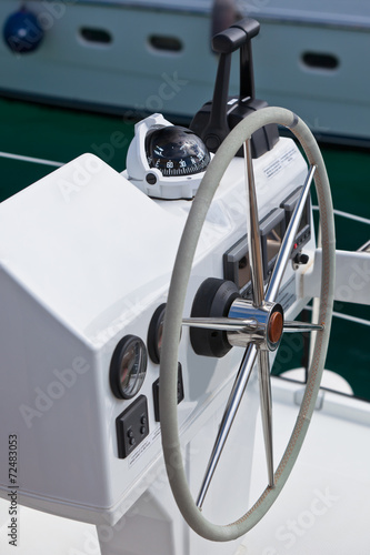 Sailing yacht control wheel and implement. © dvoevnore