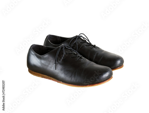 Pair of black leather shoes isolated on white
