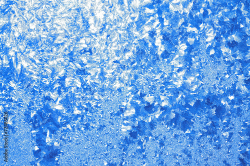 abstract shiny blue  from a frosty pattern on glass