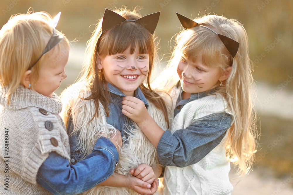 Fototapeta premium Portrait of three girls in the woods girlfriends
