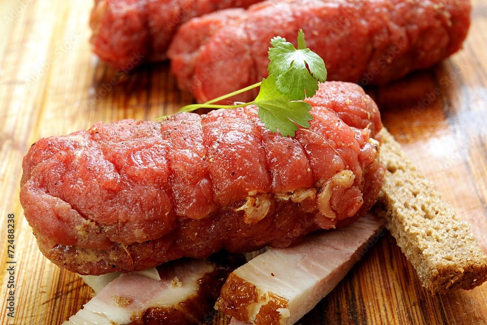 beef  roulade  with stuffing a wooden background