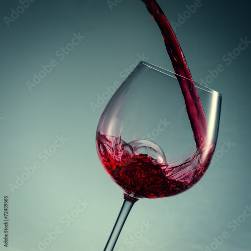 close up pouring red wine