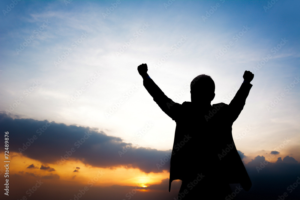 Fototapeta premium Silhouette of man raising his arms - success & winning concept