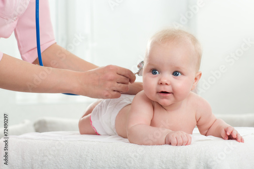 pediatrician inspection of little baby