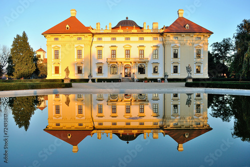 Slavkov castle reflected in water