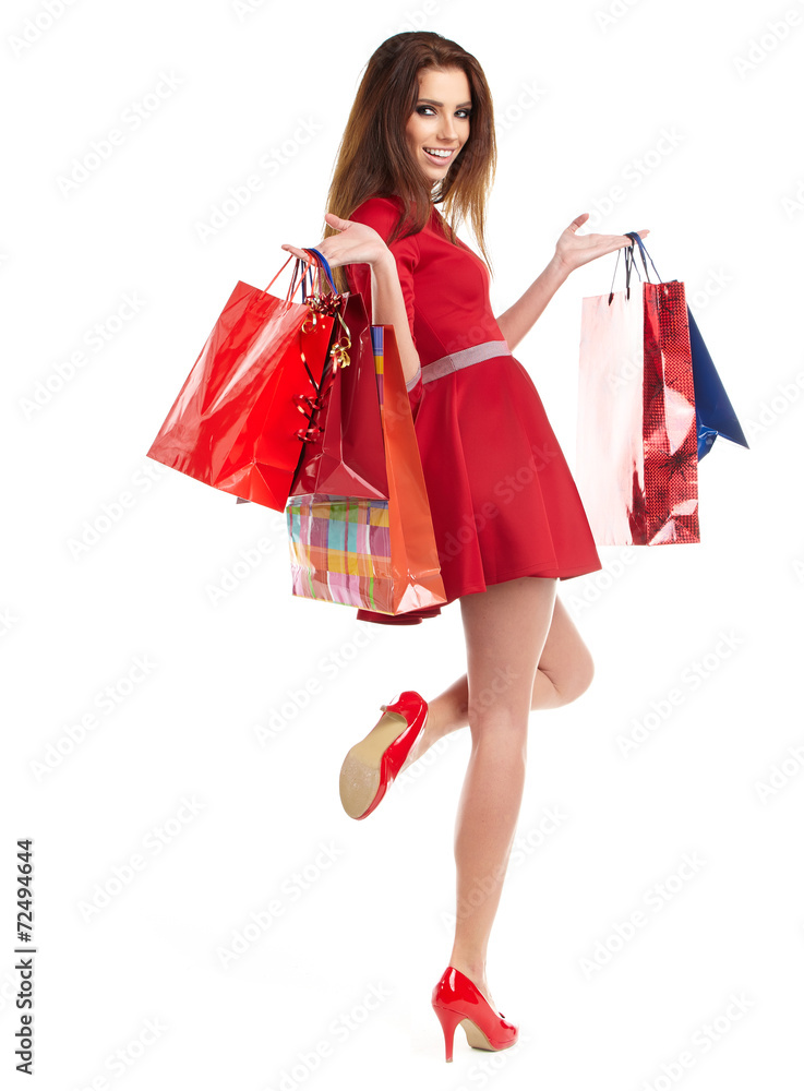 Young woman with shopping bags over white background