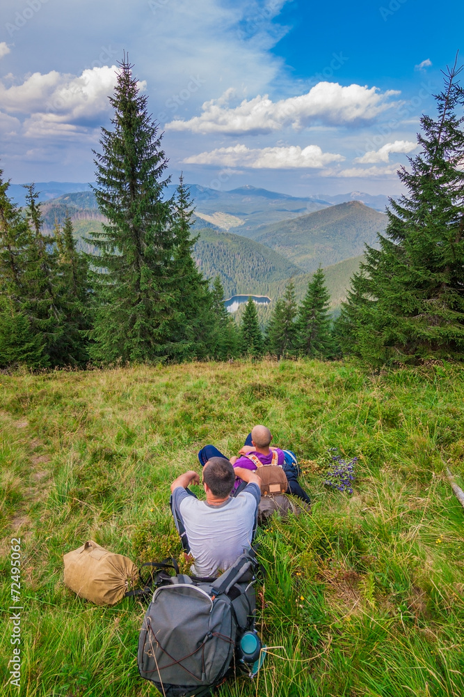 Young tourist in mountains resting Synevyr Carpathians, Ukraine.