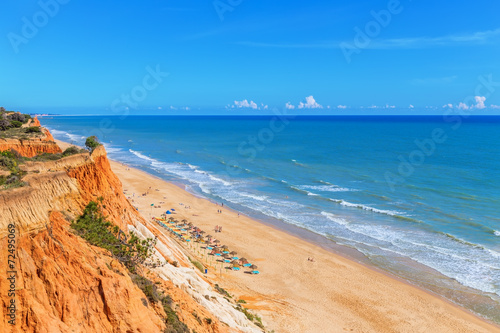 Sunny beach summer sea Albufeira in Portugal. © sergojpg