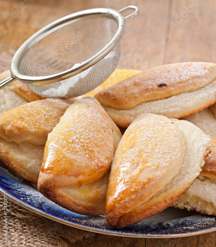 Cookies with cottage cheese sprinkled with powdered sugar photo