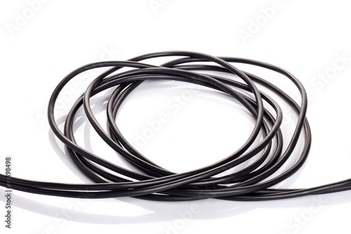 Black electric cable on white background