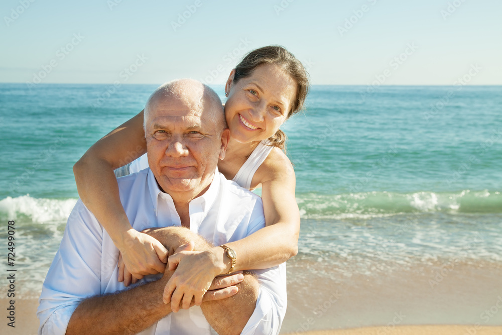 mature couple together at sea beach