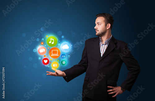Multimedia icons in the hand of a businessman