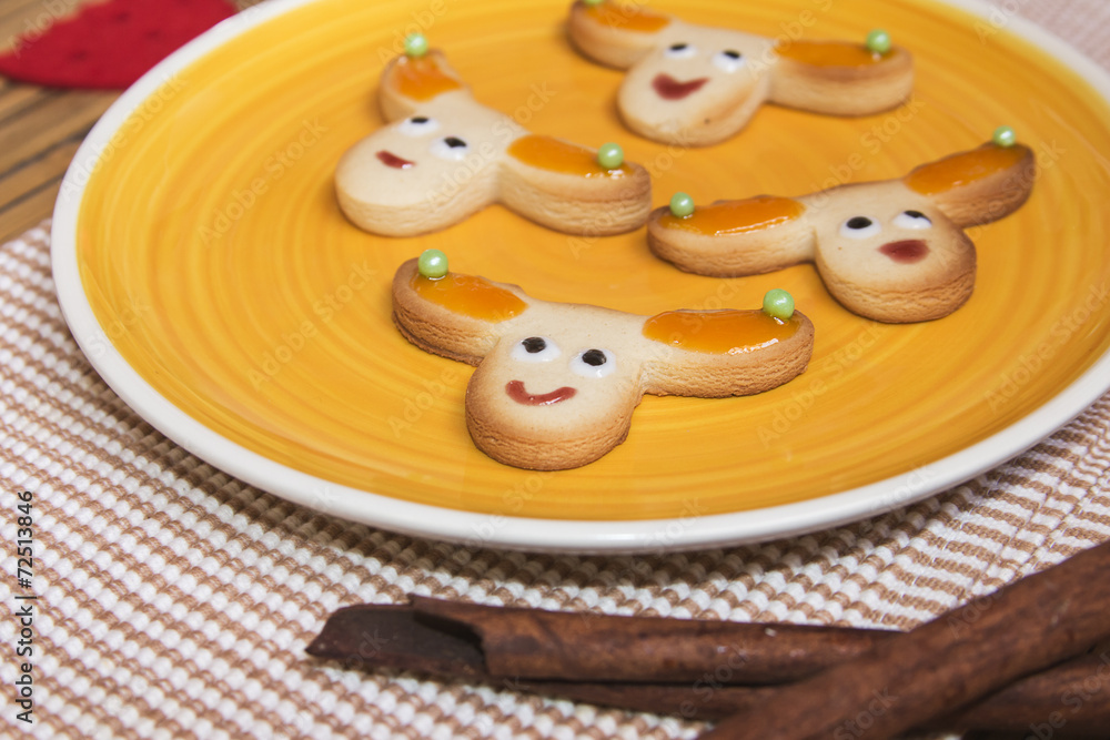 Christmas handmade cookies reindeer on wooden background